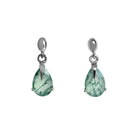 A product photo of a pair of 9x7mm pear-shaped moss agate drop earrings in 925 sterling silver on a white background. The gemstones have a cool white milky colour, with deep, swirling green natural inclusions, and are each held in place with a singular sharp prong, giving them a severe yet elegant appearance.