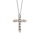 A product photo of a white gold cross pendant delicately bejewelled with pale pink morganite gemstones suspended by a chain against a white background. The Christian cross pendant is made up of 11 stones in total, with the stones at the end of each prong being slightly bigger than the centre jewels.