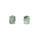 A product photo of 7x5mm Oval Shaped Moss Agate Earring Studs in 925 Sterling Silver sitting on a plain white background. The 2 moss agate stones measure 5mm across and are a deep mossy greens, and are each held in place by dainty silver claws.