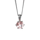 A product photo of a silver morganite pendant against a white background. The highly-reflective round cut morganite stone is held in place by 6 dainty silver claws. It is suspended by a simple silver chain.