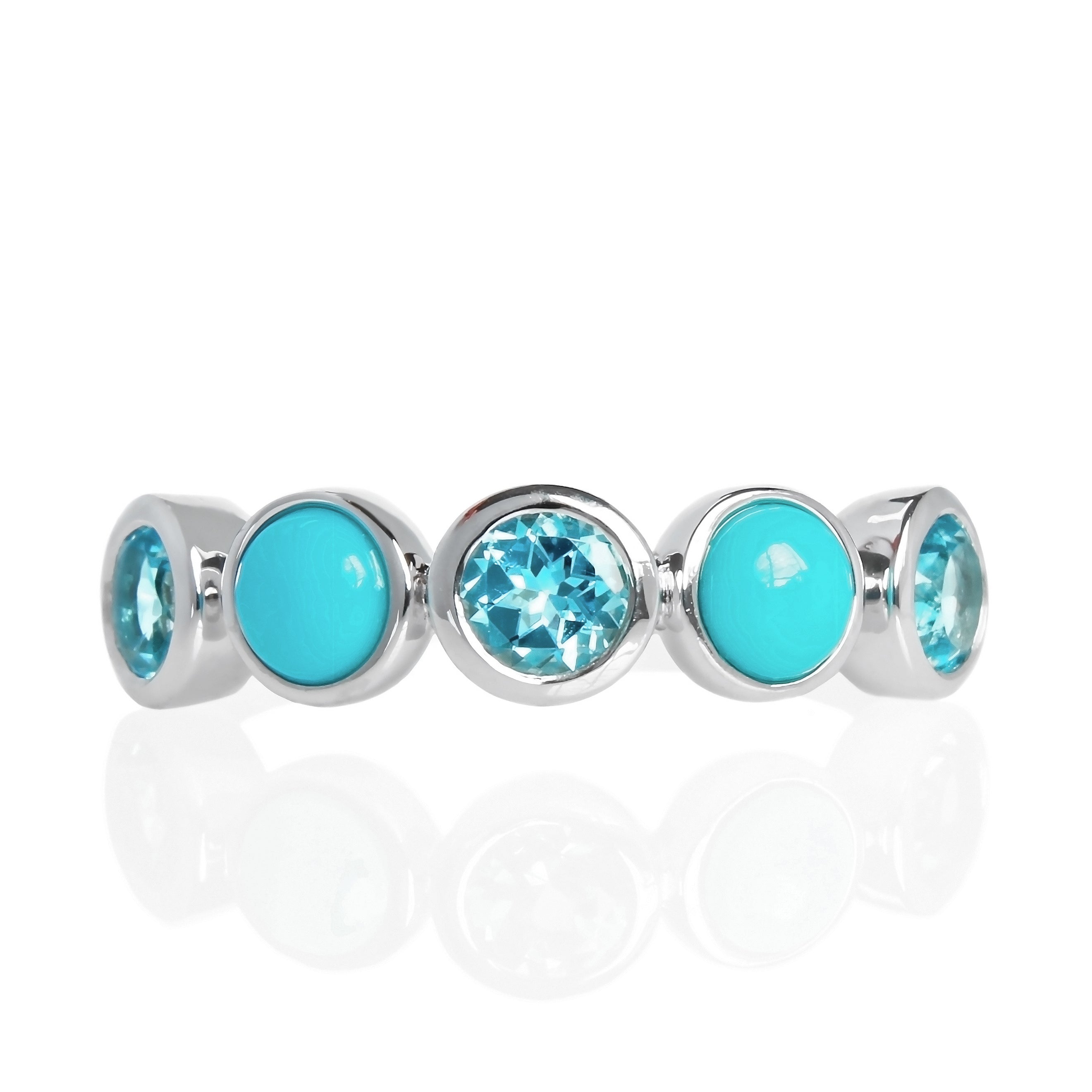 A product photo of a turquoise and blue topaz silver ring on a white background. The ring consists of 5 stones total, all 4mm in width, each encased in a layer of silver bezel setting. The 5-stone arrangement includes 3 dazzling blue topaz stones in a faceted cut, interspersed with 2 cabochon-cut blue turquoise stones - straight from the Sleeping Beauty mountains of Arizona. 