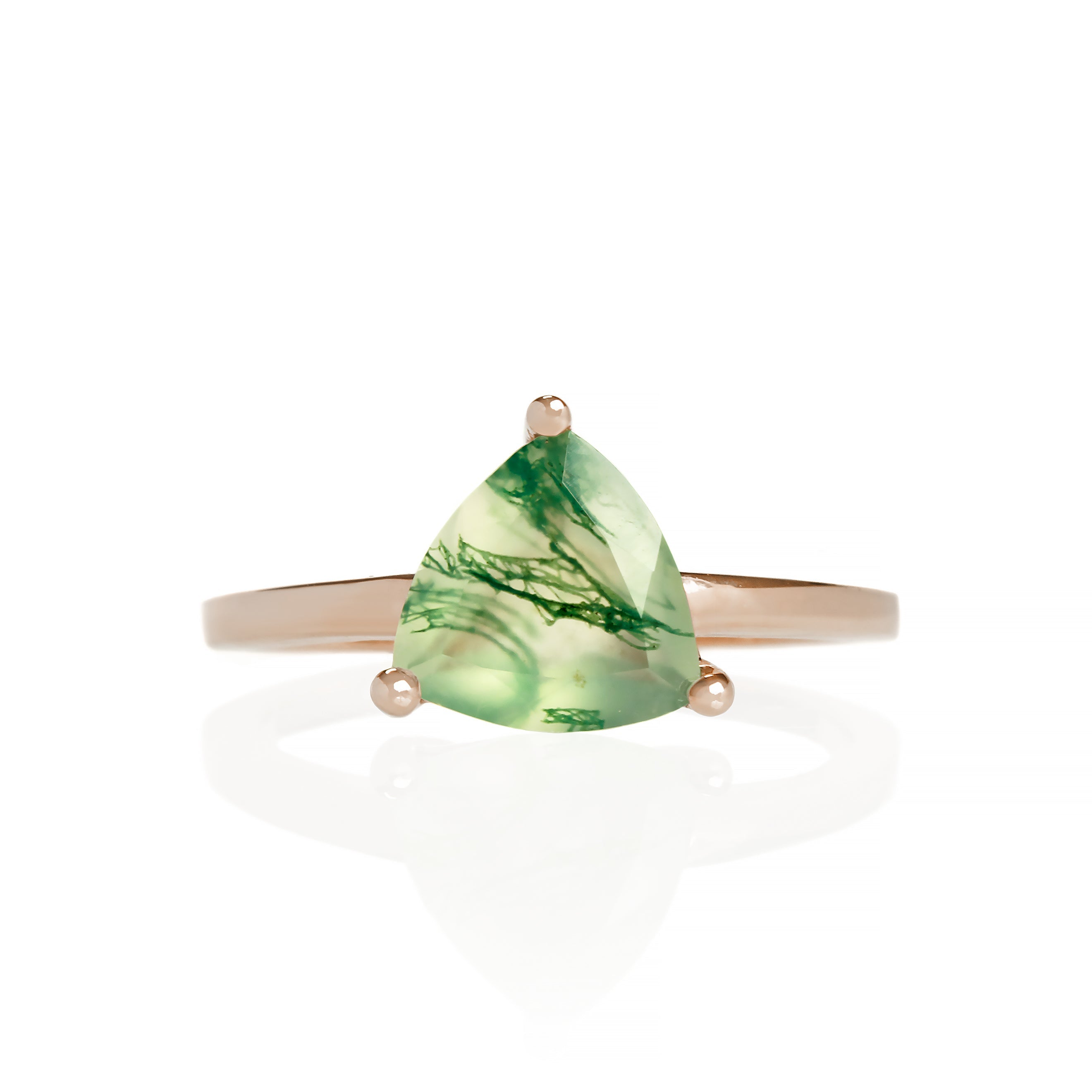 A product photo of a rose gold moss agate solitaire ring on a white background. The band is plain and smooth, meeting on either side of the 8mm trilliant faceted-cut moss agate gemstone, held in place by 3 delicate golden claws on each corner.