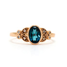 A boldy ornate statement ring with an impressive topaz centre stone and flowery diamond detailing.