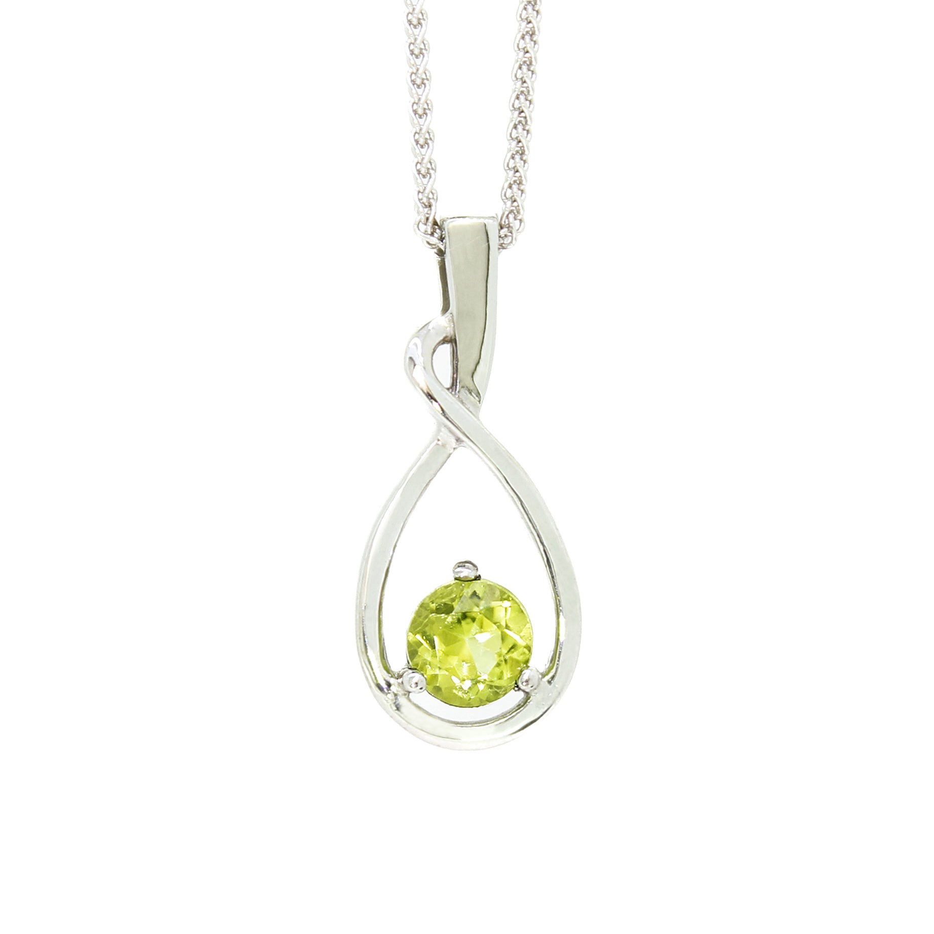 A product photo of a silver pendant with a light green peridot centre stone. The stone sits at the base of a silver teardrop shape, which curves elegantly as it flows towards the base. The pendant is suspended by a silver chain against a white background.