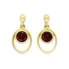 A product photo of 5.5mm Round Bezel-set Garnet Earring Studs in 9k Yellow Gold sitting on a plain white background. The bezel-set stones are nestled at the top of golden oval loops of similar thickness to the bezel frames. The garnets reflect sanguine hues across their multi-faceted edges.