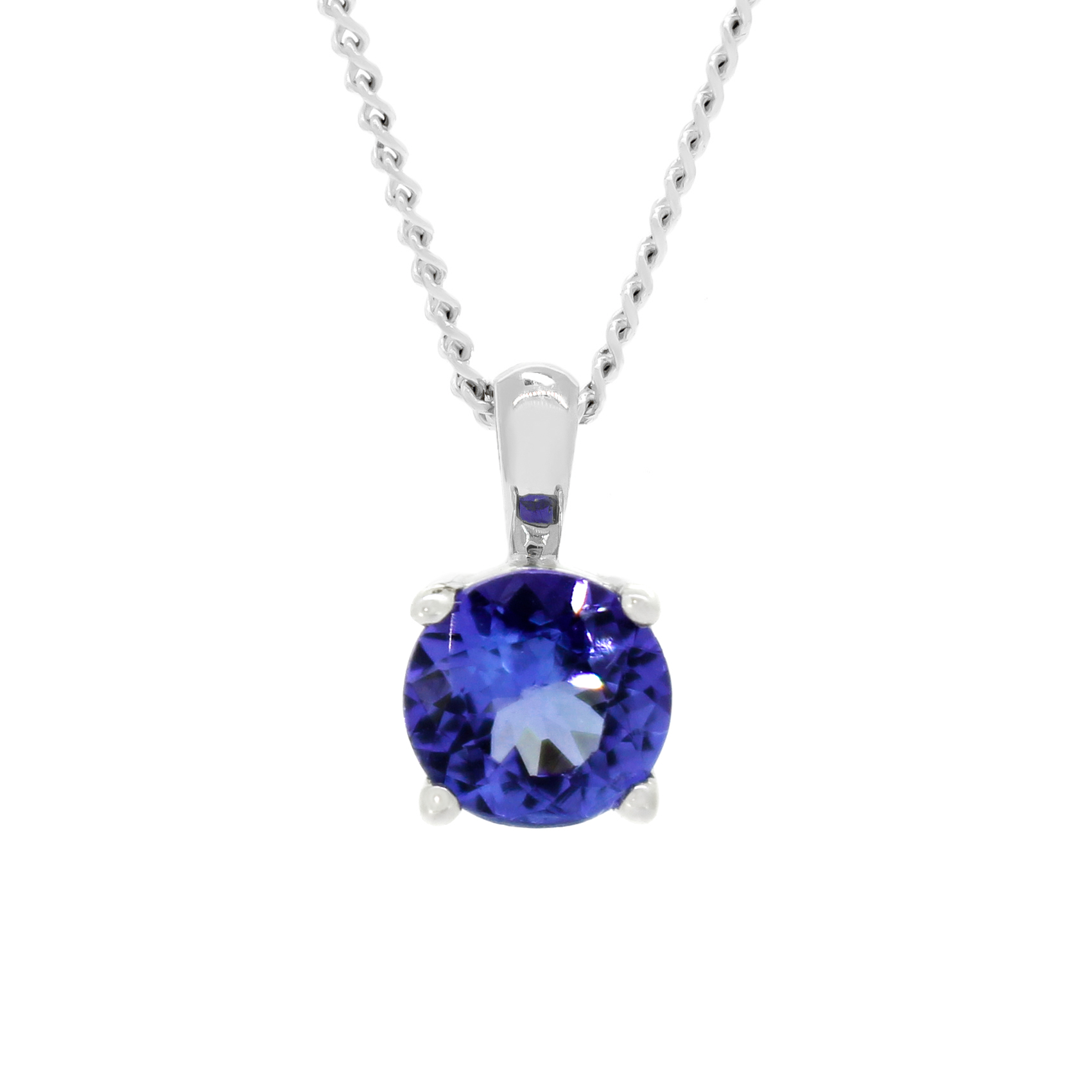 A product photo of a white gold tanzanite pendant suspended by a chain against a white background. The round stone is held in place by 4 small claws, and reflects violet blue and indigo colours from its many edges.