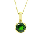 A product photo of an ornate, deep green tourmaline pendant with elaborate 9k yellow gold detailing. The 6mm round stone is a deep, vibrant, almost tsavorite-like green, and is held in place by a detailed yellow gold setting.