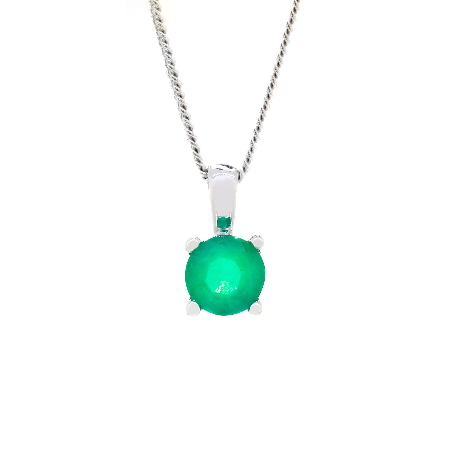 A product photo of a white gold emerald pendant suspended by a chain against a white background. The round stone is held in place by 4 small claws, and reflects ocean green hues from its many edges.