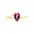 A product photo of a yellow gold grape garnet ring sitting against a white background. The gold band is plain and smooth, and curves to meet at the top and bottom of a large, 7x5mm pear shaped grape garnet centre stone - holding it in place.