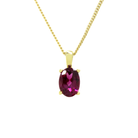 A product photo of a yellow gold rhodalite pendant suspended by a chain against a white background. The oval stone is held in place by 4 small claws, and reflects deep purple and magenta colours from its many edges.