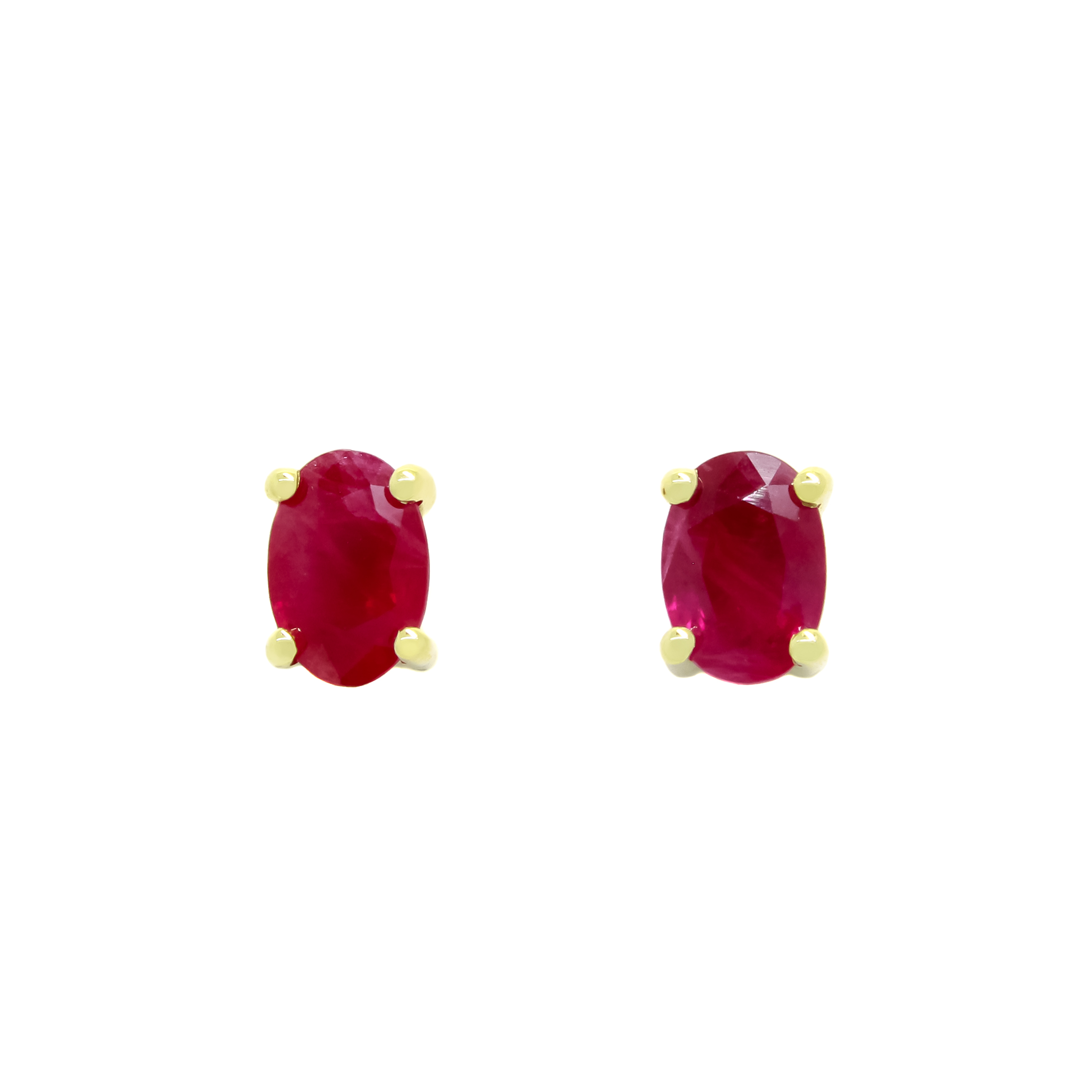 A product photo of 6x4mm Oval Shaped Ruby Earring Studs in 9k Yellow Gold sitting on a plain white background. The 2 ruby stones measure 4mm across and are deep red, reflecting sanguine and magenta hues across their multi-faceted edges, and are each held in place by dainty golden claws.