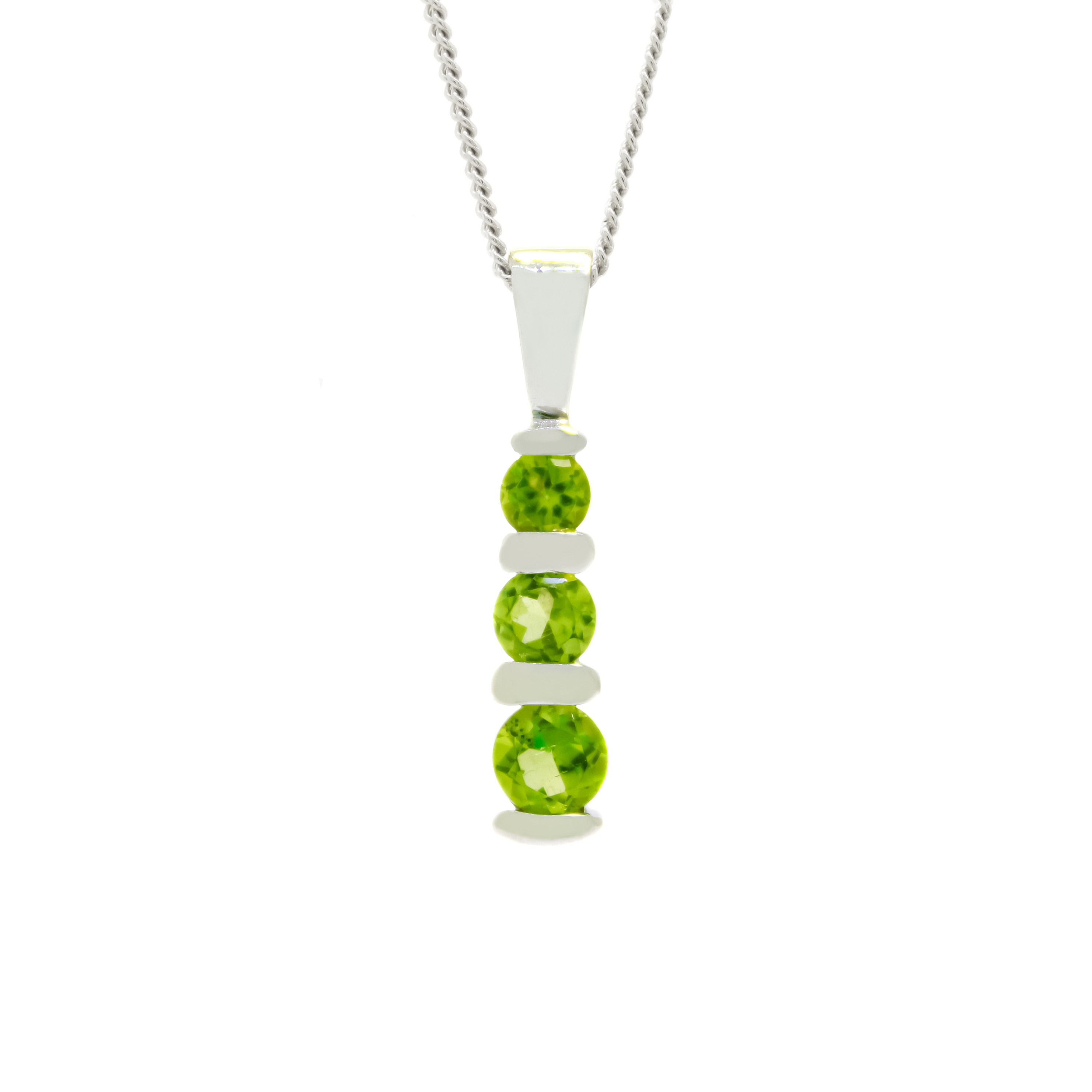 A product photo of a 9ct white gold peridot pendant made up of 3 stones stacked vertically, descending from smallest to largest. The pendant is suspended by a golden chain against a white background.