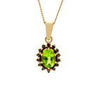 A product photo of a lavishly ornate peridot pendant bejewelled with a black diamond halo in solid 9ct rose gold suspended by a golden chain against a white background. The large peridot gemstone is oval-shaped, and is surrounded by a star-like halo of rose gold and black diamond details.