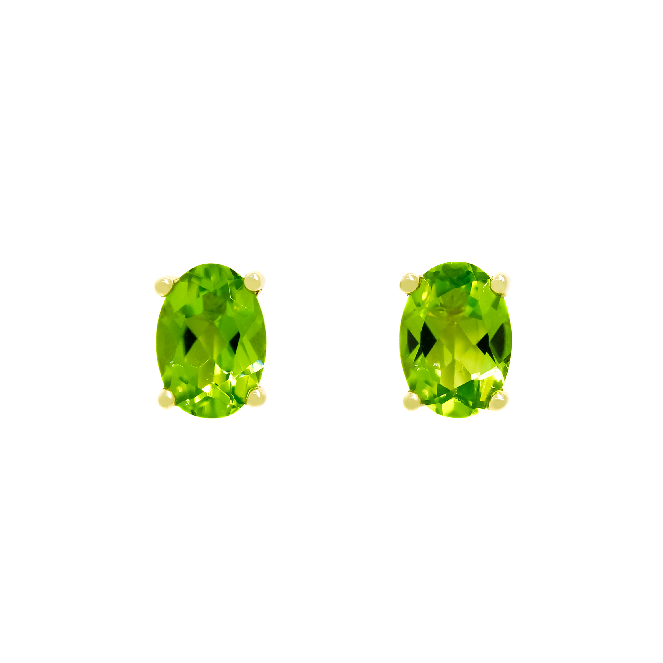 A product photo of 7x5mm Oval Shaped Peridot Earring Studs in 9k Yellow Gold sitting on a plain white background. The 2 peridot stones measure 5mm across and are a bright grassy green, reflect chartreuse hues across their multi-faceted edges, and are each held in place by dainty golden claws.