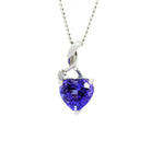 A product photo of a romantic tanzanite and diamond heart pendant in 9ct white gold suspended by a gold chain over a white background. The pendant is made up of a heart-shaped tanzanite jewel, which reflects violet and indigo hues from its faceted surfaces - accented by a single white diamond. The two jewels are suspended by a curved, delicate golden bail.