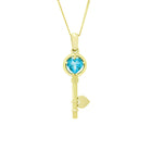 A product photo of a ceremonial blue topaz key necklace set in solid 9ct yellow gold. The design is left purposefully vague, so it may serve as a traditional 21st birthday present or as a romantic gift - the key to the wearer's heart. The design consists of smooth and simple gold, with a heart-shaped topaz stone encased in a circular golden frame as the bow of the key, while the rest of the key's design is simple.