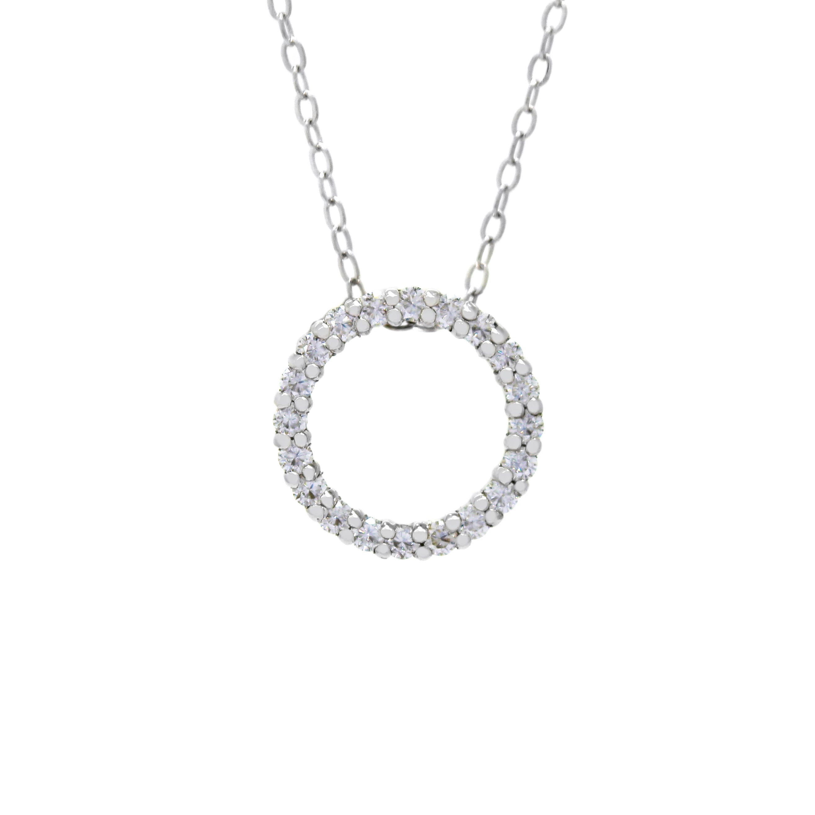 A product photo of a solid 9ct white gold and moissanite pendant suspended by a golden chain against a white background. The design is made up of 20 moissanite jewels arranged in a perfect hollow circle, reminiscent of an abstract ouroboros jewellery design. All of the moissanite jewels are held in place by delicate golden claws.