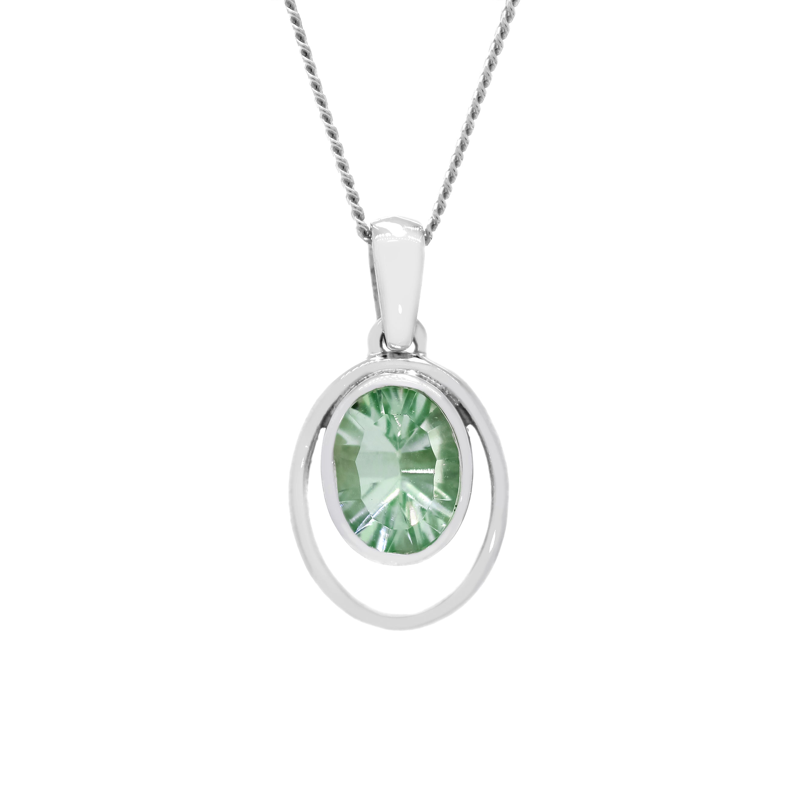 A product photo of a 5.5mm Round Bezel-set Green Amethyst Pendant in 9ct White Gold sitting on a plain white background. The bezel-set stone is nestled at the bottom of a golden oval hoop of similar thickness to the bezel frame. The peridot reflects chartreuse hues across its multi-faceted edges.