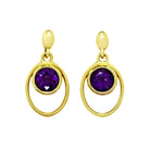 A product photo of 5.5mm Round Bezel-set Amethyst Earring Studs in 9k Yellow Gold sitting on a plain white background. The bezel-set stones are nestled at the top of golden oval loops of similar thickness to the bezel frames. The amethysts reflect deep purple hues across their multi-faceted edges.