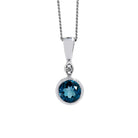 A product photo of a large, 6mm round London Blue Topaz and diamond pendant suspended by a 9ct white gold chain over a plain white background. The 6mm round London Blue Topaz stone is a deep, dark blue, and is set in a thick white golden bezel setting.