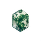 A product image of a loose 14x10mm faceted moss agate gemstone in the shape of an elongated hexagon. The stone has a cool white milky colour, with deep, swirling green natural inclusions - appearing as moss-like structures or delicate inkspills within the stone. The faceted edges reflect bright white light.