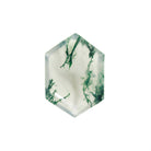 A product image of a loose 14x10mm faceted moss agate gemstone in the shape of an elongated hexagon. The stone has a cool white milky colour, with deep, swirling green natural inclusions - appearing as moss-like structures or delicate inkspills within the stone. The faceted edges reflect bright white light.