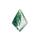 A product image of a loose 14x10mm faceted moss agate stone in the classic kite-shaped gemstone cut. The stone has a cool white milky colour, with deep, swirling green natural inclusions - appearing as moss-like structures or delicate inkspills within the stone. The faceted edges reflect bright white light.