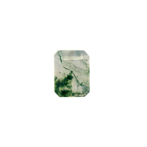 A product image of a loose 8x6mm faceted emerald-shaped moss agate stone. The stone has a cool white milky colour, with deep, swirling green natural inclusions - appearing as moss-like structures or delicate inkspills within the stone. The faceted edges reflect bright white light.