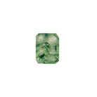 A product image of a loose 8x6mm faceted emerald-shaped moss agate stone. The stone has a cool white milky colour, with deep, swirling green natural inclusions - appearing as moss-like structures or delicate inkspills within the stone. The faceted edges reflect bright white light.