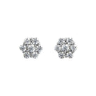 A product photo of a pair of moissanite stud earrings in 9k white gold sitting on a white background. Each earring consists of 6 little moissanite stones arranged around a single moissanite centre-stone in a floral-like pattern.