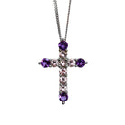 A product photo of a white gold cross pendant delicately bejewelled with multi-coloured gemstones suspended by a chain against a white background. The Christian cross pendant is made up of 11 stones in total, with the stones at the end of each prong being slighly bigger than the centre jewels.