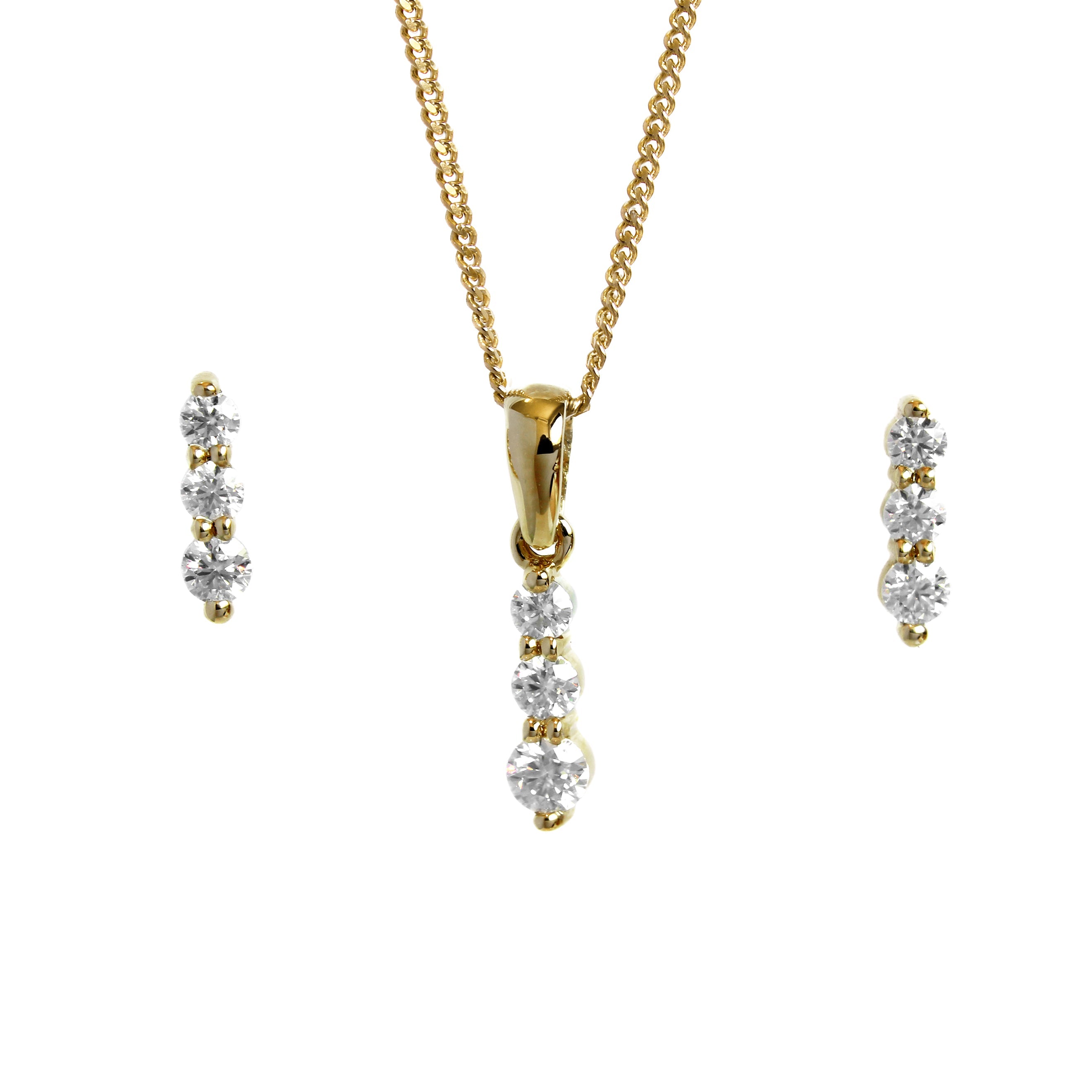 A product photo of a women's jewellery gift set in 9ct yellow gold and sparkling moissanite suspended against a white background. The yellow gold moissanite earrrings, each made up of 3 stones stacked vertically, descending from smallest to largest, sit on either side of a pendant of the same design suspended by a golden chain.